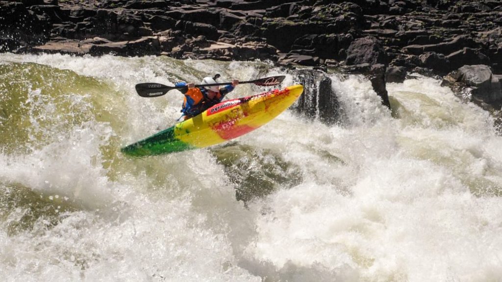 Bren Orton paddles his Pyranha Ripper half slice kayak on the Zambezi river in Africa.